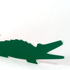 Schallabsorber aus PET Vlies, grün kaschiert, in Form eines Krokodils.
